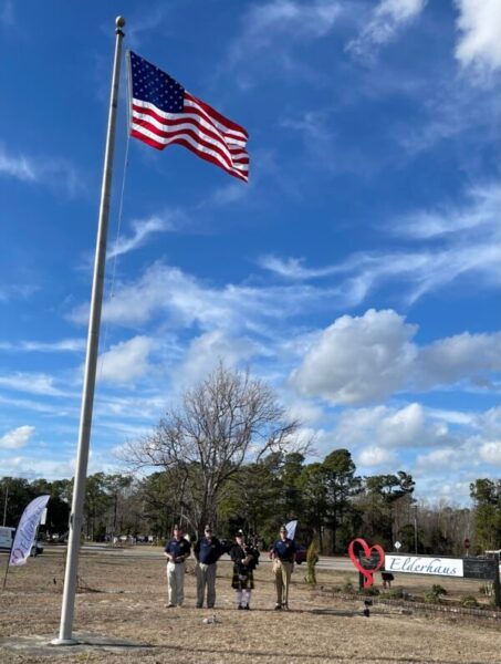 Post 68 raises flag at  the new Elderhaus center